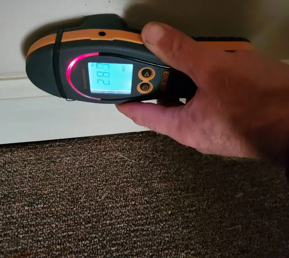 Moisture detection at baseboard during Storm Damage Restoration in Moultrie